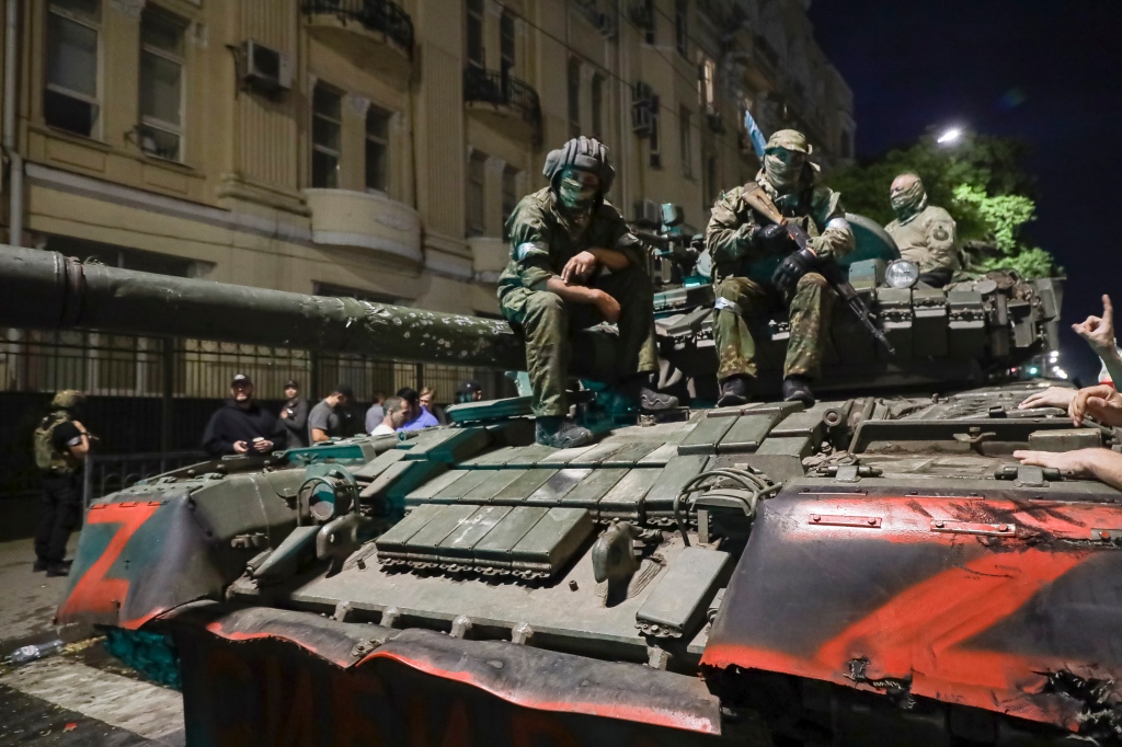 Members of the Wagner Group military company in Rostov-on-Don, Russia, Saturday, June 24, 2023, as they prepare to leave an area at the headquarters of the Southern Military District. 