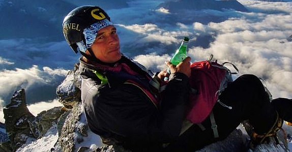 Julian Sands is pictured sitting on a peak of the Weisshorn mountain in the Swiss Alps.