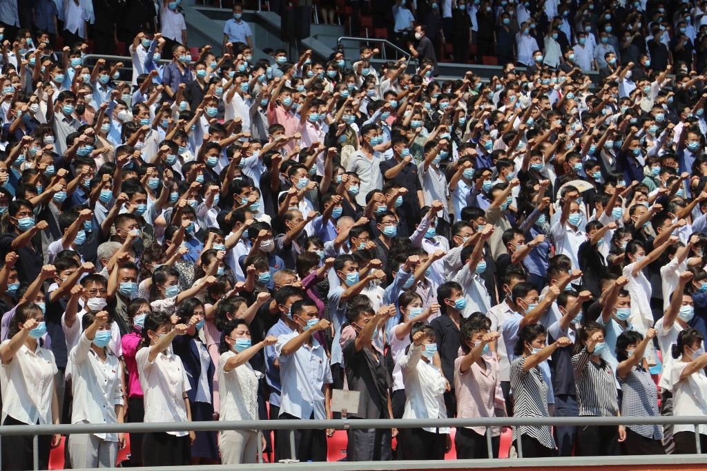 Pyongyang people take part in a demonstration after a mass rally to mark what North Korea calls "the day of struggle against U.S. imperialism" at the May Day Stadium in Pyongyang, North Korea Sunday, June 25, 2023.