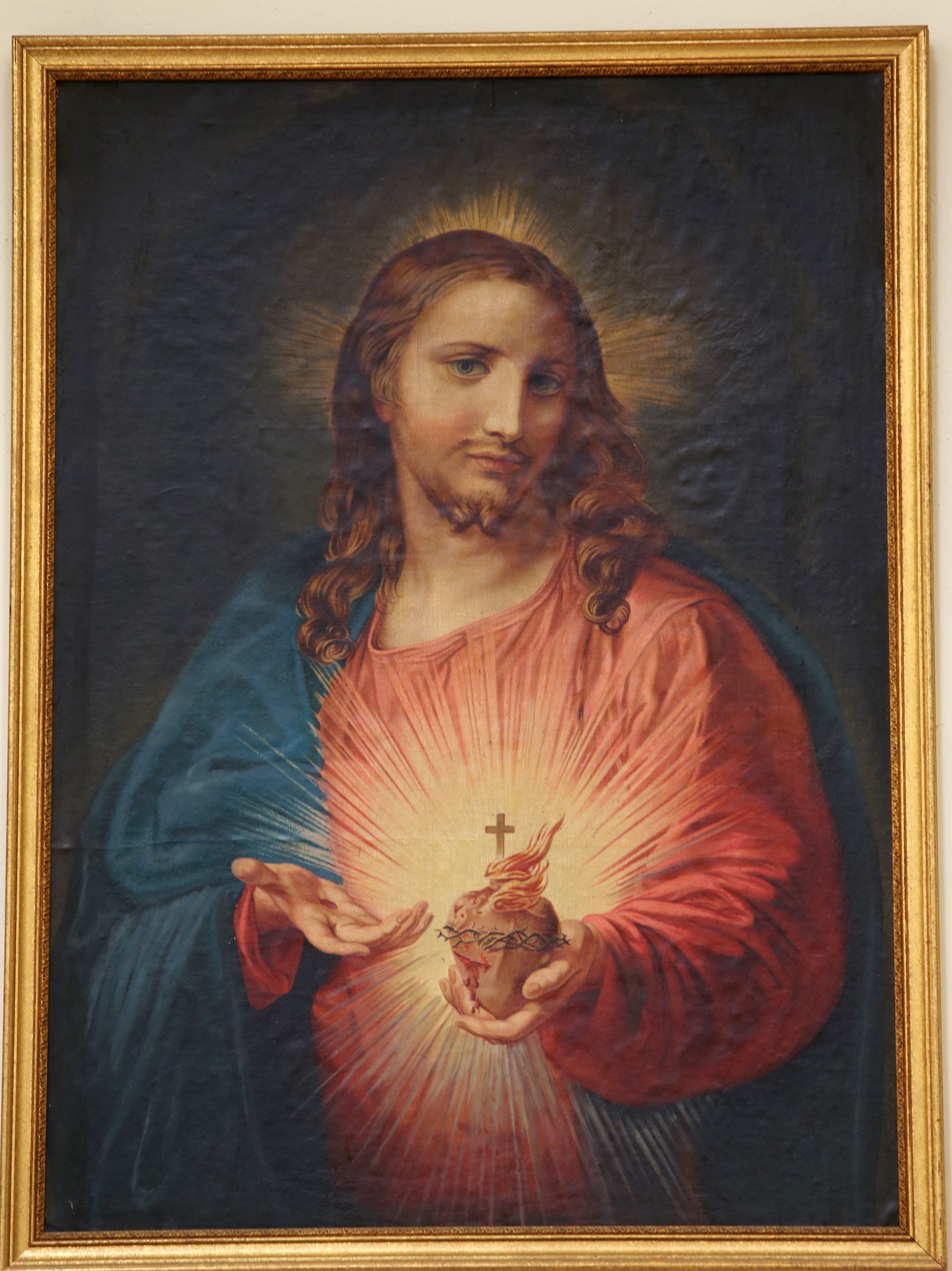 A framed picture of the Sacred Heart of Jesus 