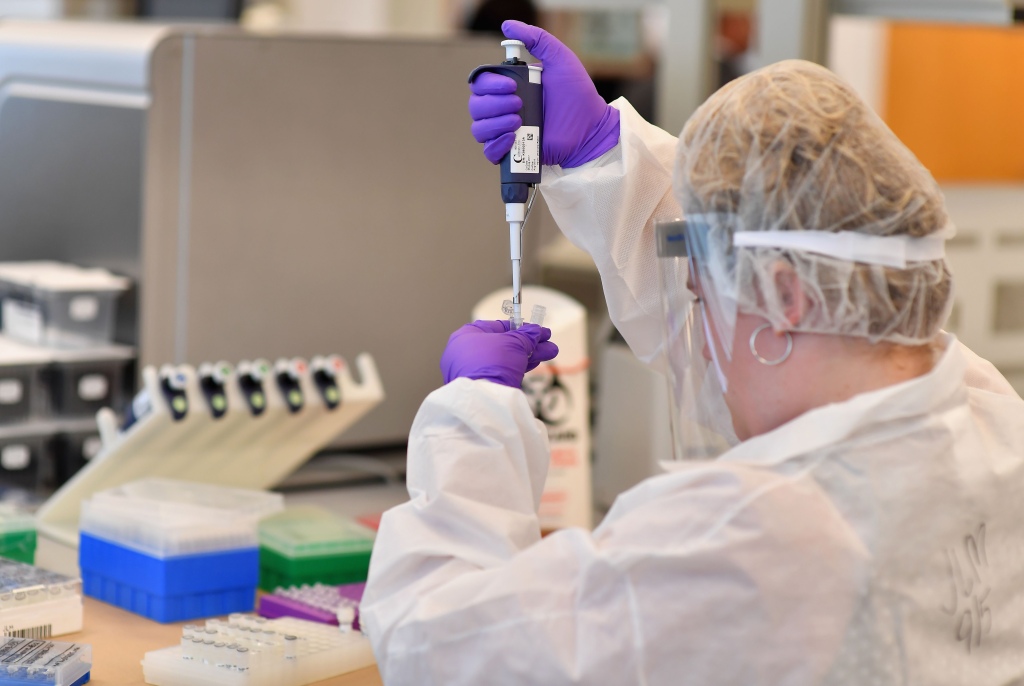 Lab worker doing DNA extraction