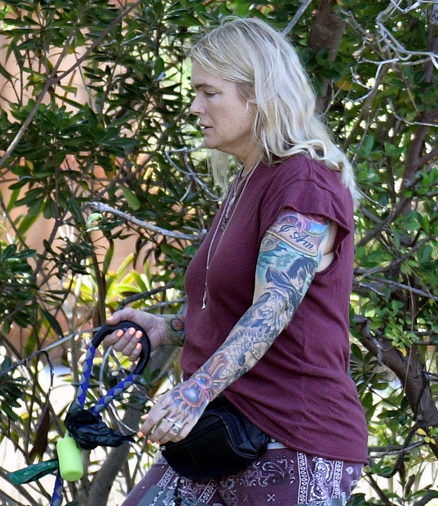 Eleniak's tattoos include an etching of an eagle wearing a witch's hat, as well as the words "I Am" emblazoned on her left bicep. 