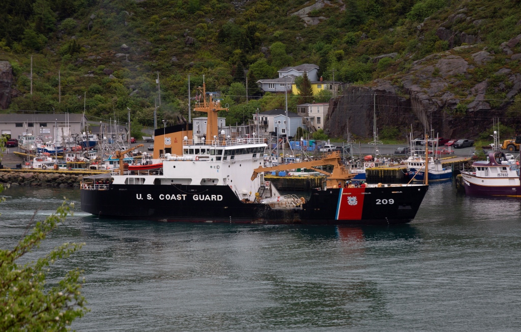 A U.S. Coast Guard ship arrives in the harbor of St. John's Newfoundland on Wednesday, June 28, 2023, following the arrival of the ship Horizon Arctic carrying debris from the Titan submersible.