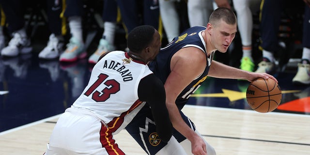 Nikola Jokic backs down Bam Adebayo