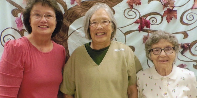 Sandra Hemme (center) pictured with her sister (right) and mother (left)