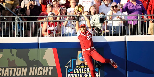 Jayda Coleman hits wall to catch ball