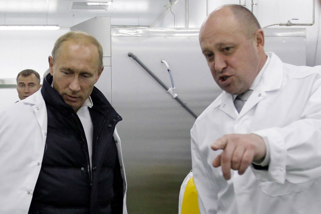 Yevgeny Prigozhin shows Russian Prime Minister Vladimir Putin his school lunch factory outside Saint Petersburg on September 20, 2010. 