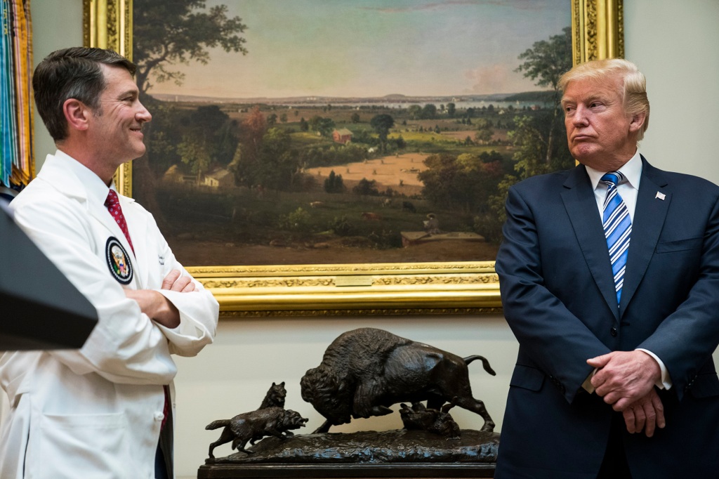 President Donald Trump looks to White House physician Ronny Jackson during a Veterans Affairs Department "telehealth" event in the Roosevelt Room of the White House in Washington, DC on Thursday, Aug 03, 2017. 