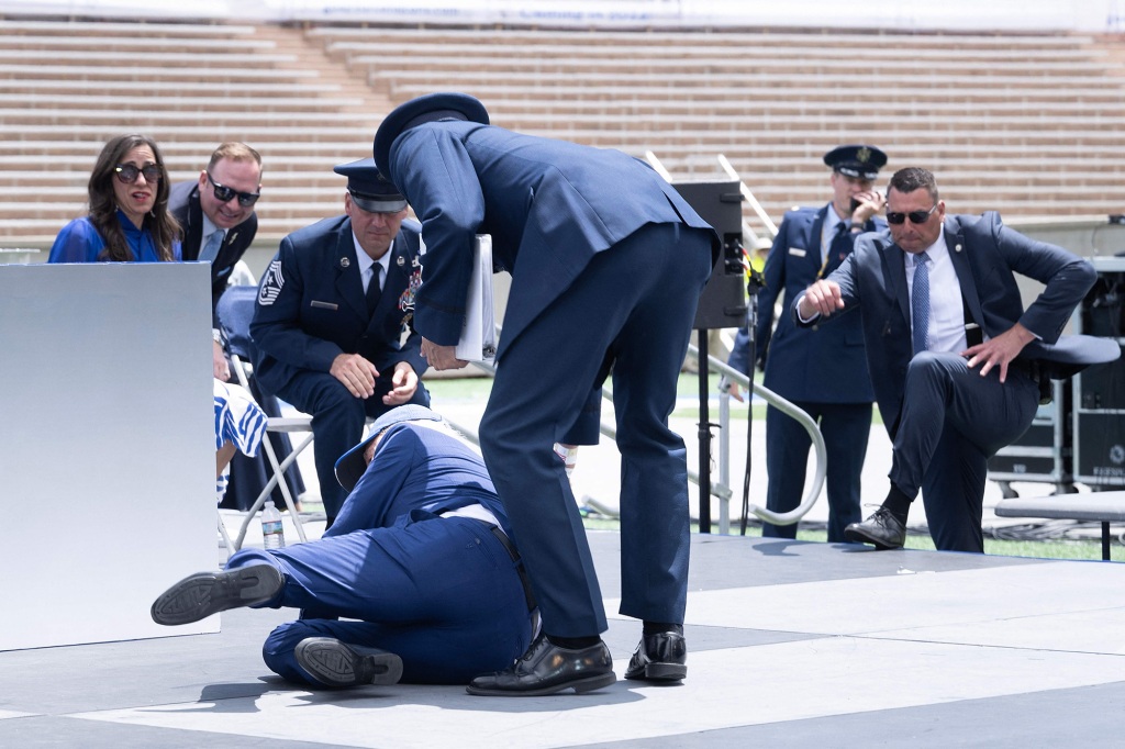 Joe Biden falls during the graduation ceremony at the United States Air Force Academy, just north of Colorado Springs in El Paso County, Colorado, on June 1, 2023. (