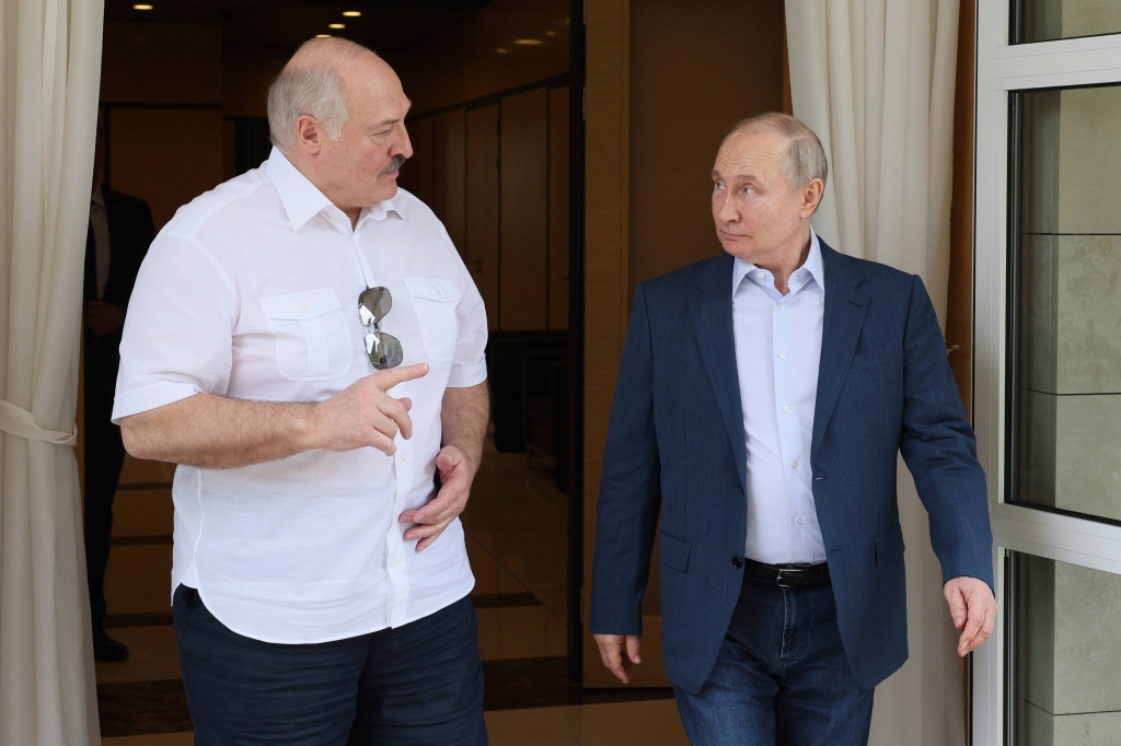 Putin speaks with Belarusian President Alexander Lukashenko on June 9. Putin said Russian tactical nuclear warheads had already been delivered to close ally Belarus,