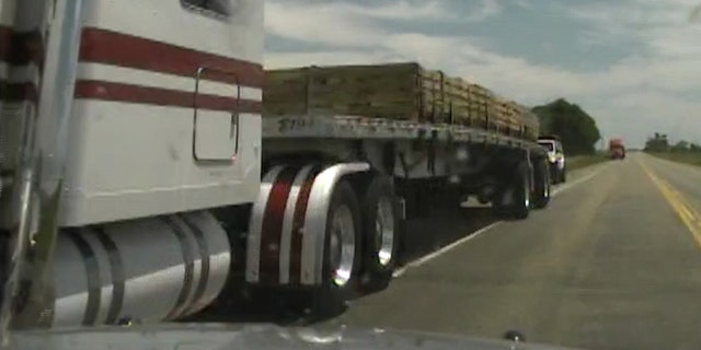 Moment before stolen police car hits tractor-trailer on Highway 50 in Colorado