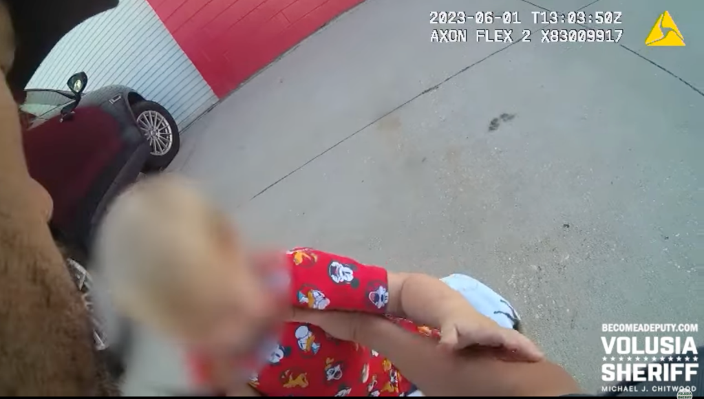 Volusia County police later arrived and found the unharmed child laying on a horse-printed blanket, wearing red pajamas as deputies attempted to calm him down with an Elmo toy.