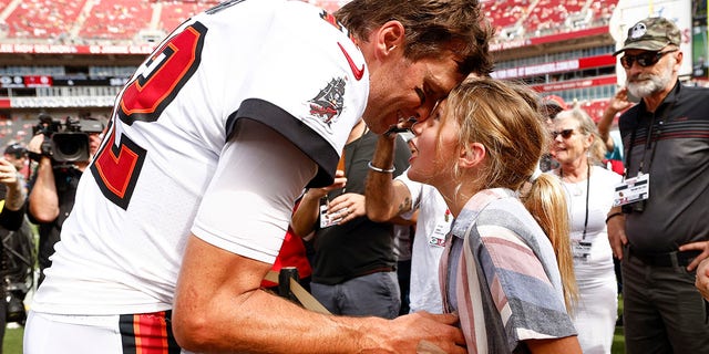 Tom Brady talks with his daughter Vivian