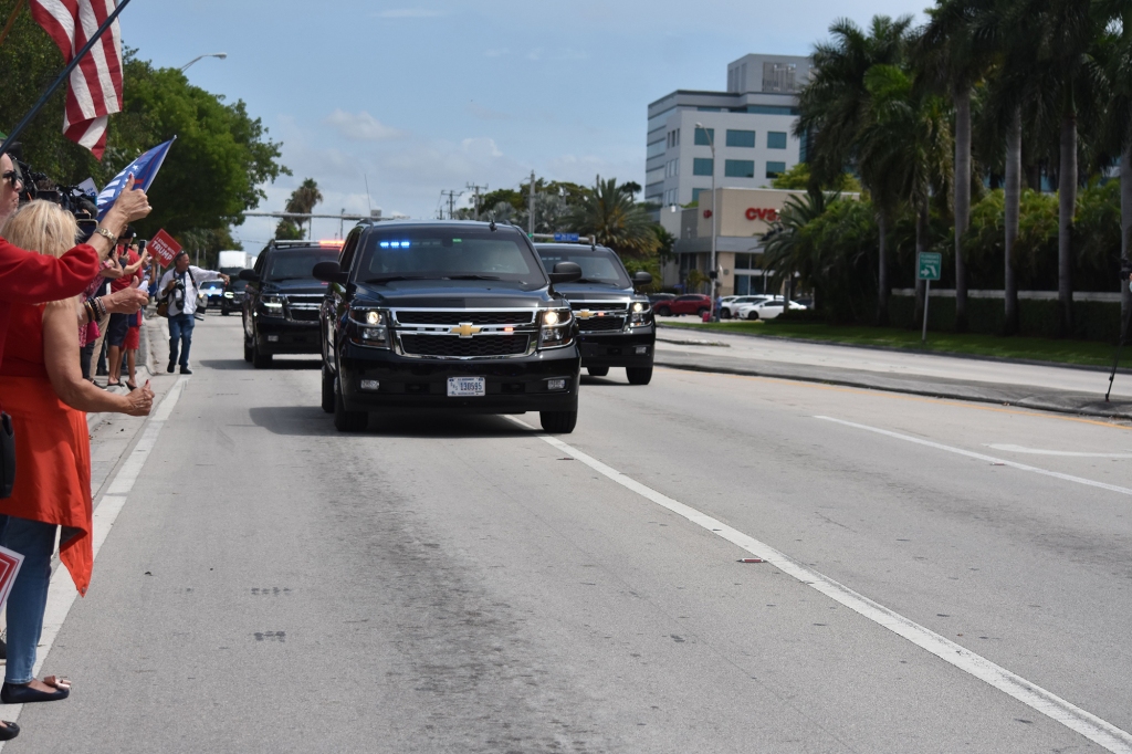 Supporters waves and greet Trump as he arrives in Miami a day before his scheduled arraignment on a 37-count federal indictment involving classified documents on June 12, 2023.