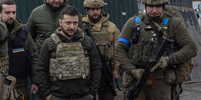 A group of men wearing military gear.