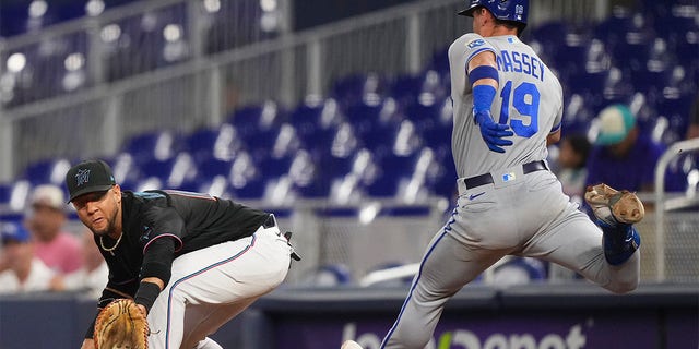 Michael Massey is thrown out at first base