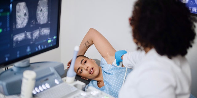 Woman getting mammogram