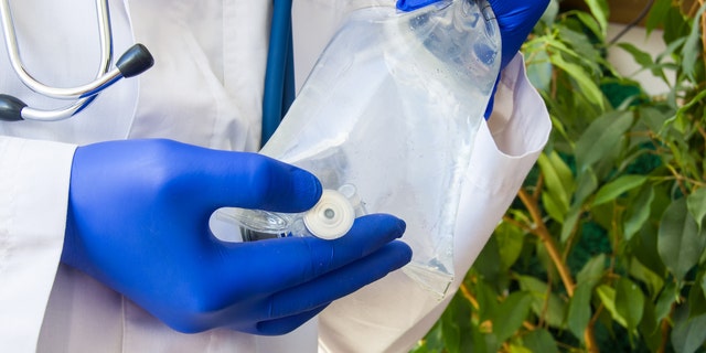 Doctor with IV bag