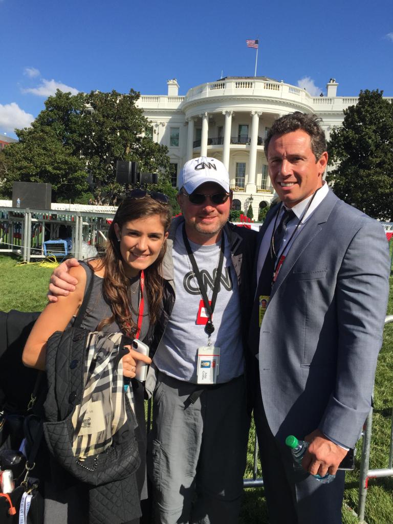 John Griffin poses with CNN's Chris Cuomo and a staffer at the White House in 2015.