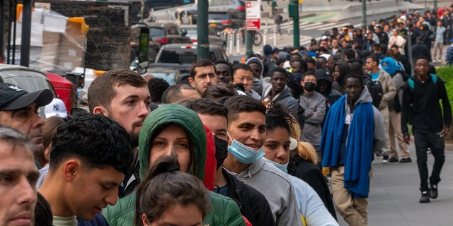 Asylum-seekers outside Javits building