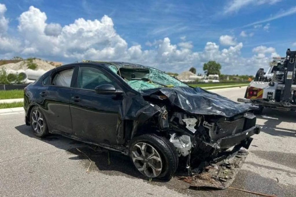 The black Kia sedan the teens were driving in is shown. 