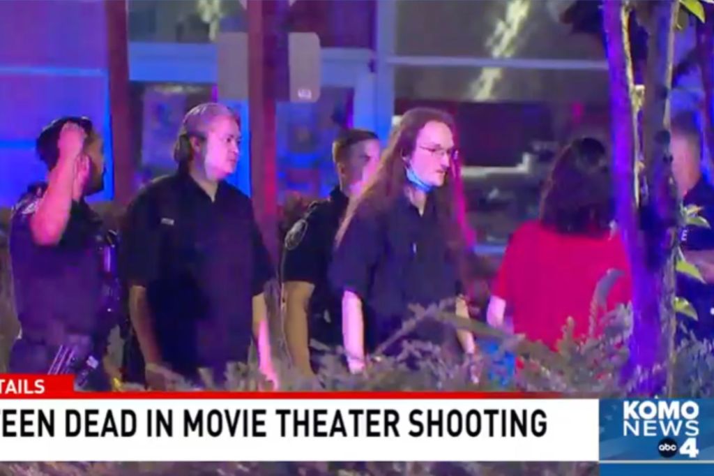 Movie-attenders are escorted outside of the AMC movie theater following the deadly shooting on June 13, 2023, in Kent, Washington. 