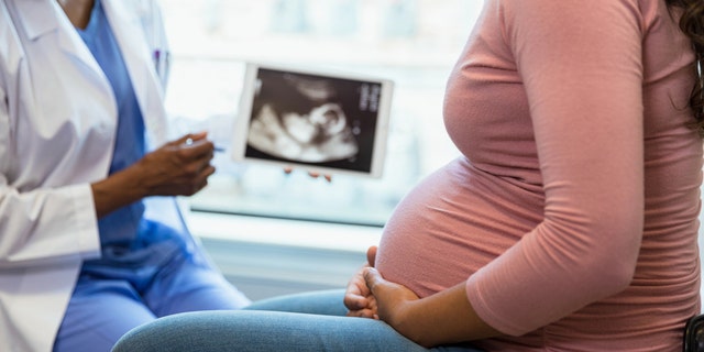 Pregnant woman at doctor