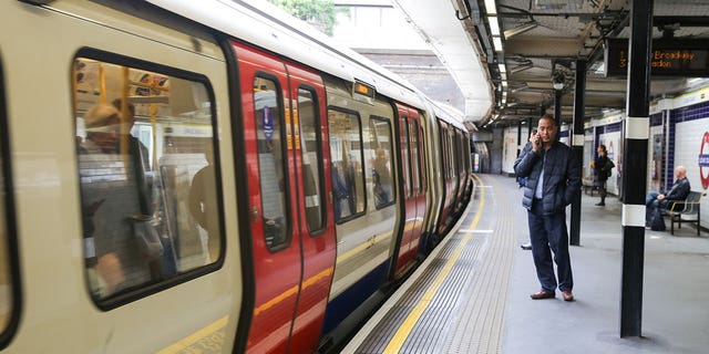 A subway train at Sloane Square station in London, England