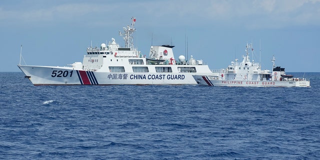 Chinese and Philippine coast guard boats facing off