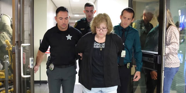 susan lorincz walking handcuffed