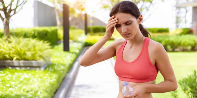 Woman having heat stroke