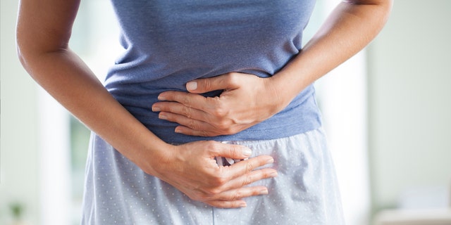 Woman with stomach pain