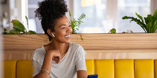 Woman wearing earbuds