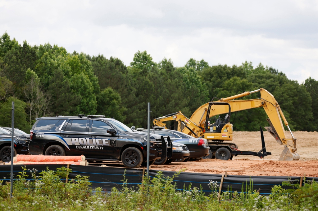 Atlanta Police Department cars are parked at one of the Atlanta Public Safety Training Center construction site entrances on Tuesday, May 30, 2023.