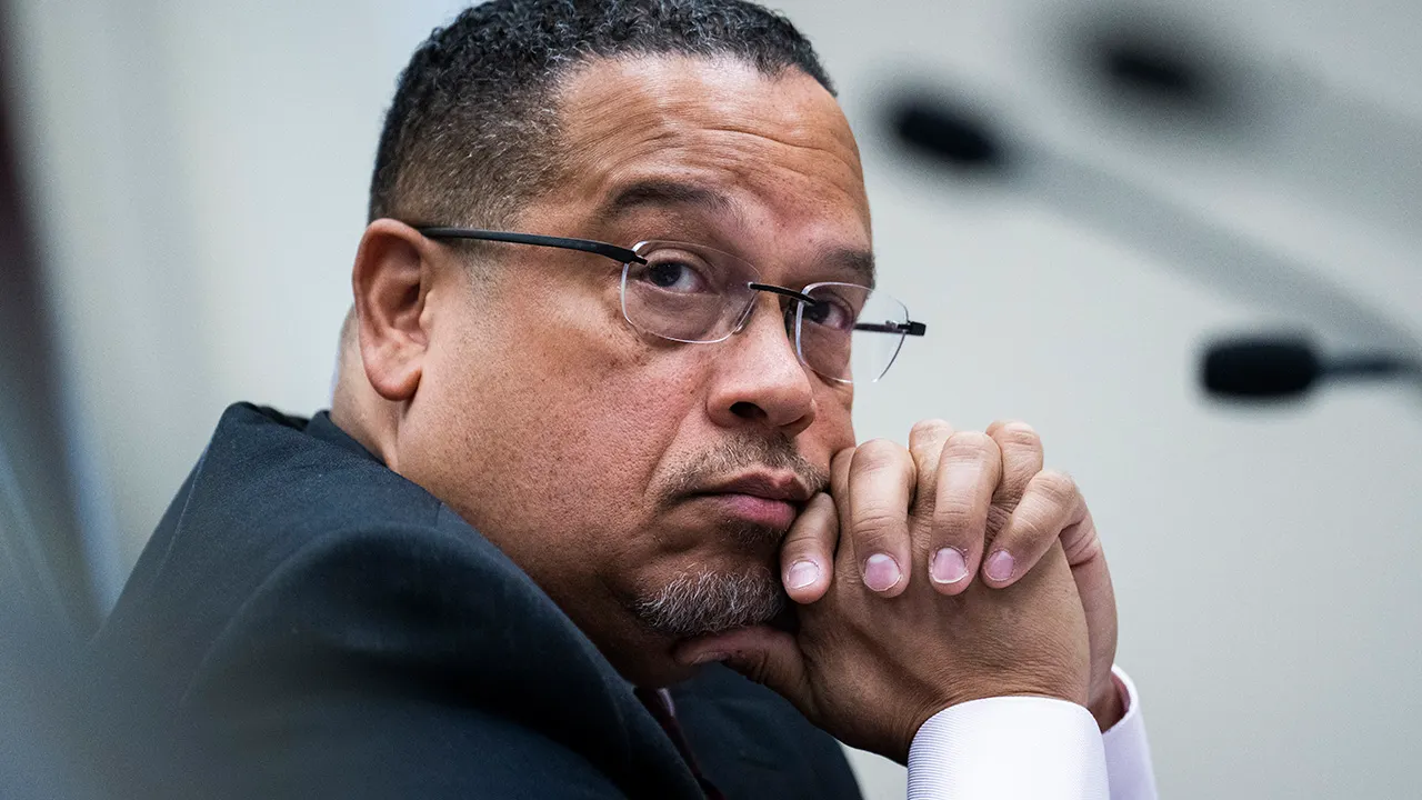 Keith Ellison sits in committee hearing