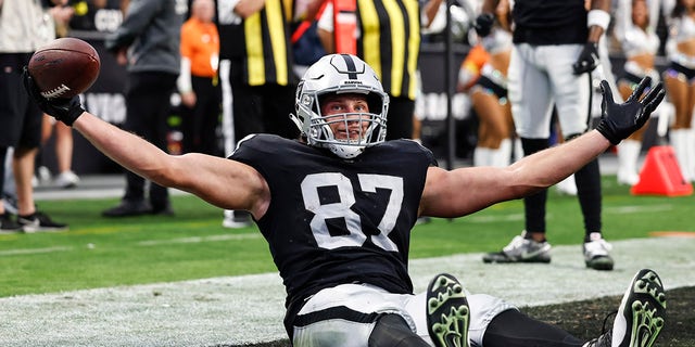 Foster Moreau celebrates touchdown