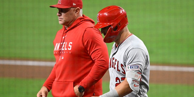 Mike Trout walks with Phil Nevin