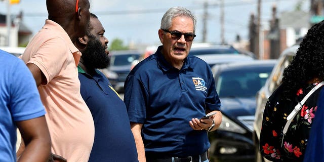 District Attorney Larry Krasner listens to community members