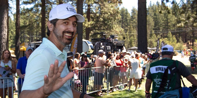 Ray Romano walks the course