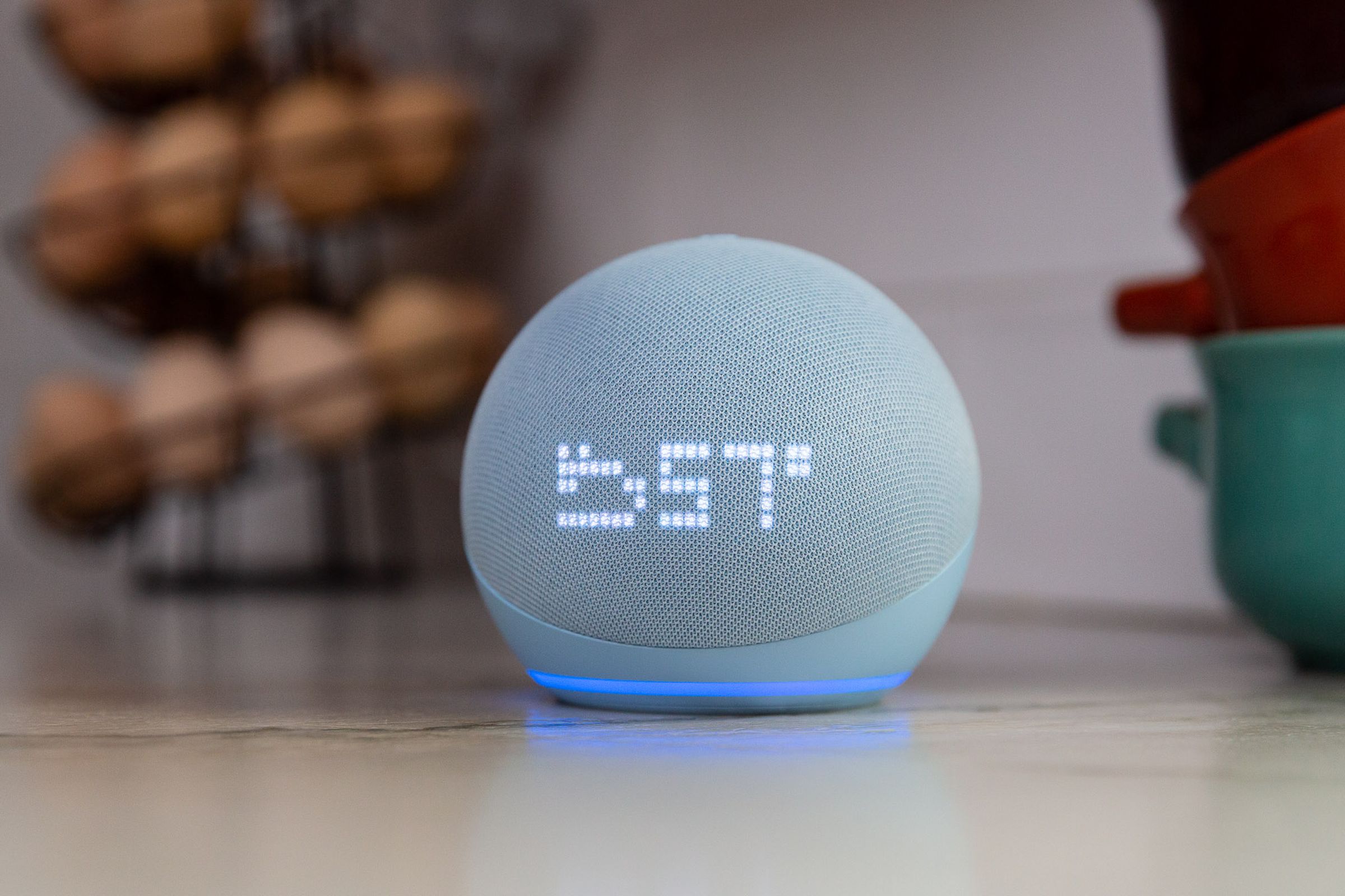 An Echo Dot with Clock on a kitchen counter