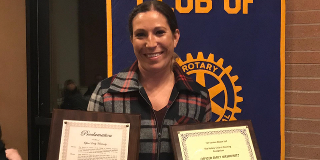 NY police officer Emily Hirshowitz holding award