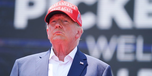 Donald Trump wearing a red Make America Great Again hat