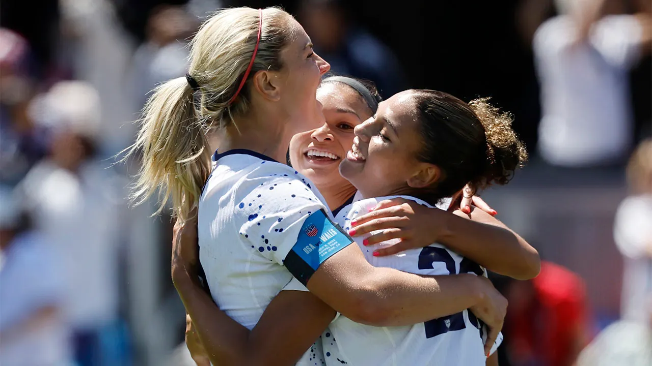 Lindsey Horan, Sophia Smith, and Trinity Rodman celebrate