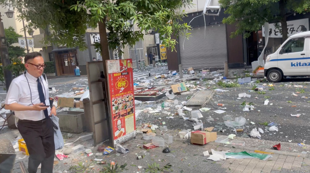 Debris is scattered on the ground following an explosion in a building in Tokyo, Japan on July 3, 2023. 