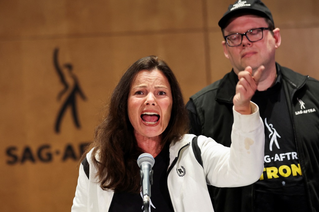 SAG-AFTRA union President Fran Drescher speaks next to Duncan Crabtree-Ireland, SAG-AFTRA National Executive Director and Chief Negotiator, at SAG-AFTRA offices after negotiations ended with the Alliance of Motion Picture and Television Producers (AMPTP), the entity that represents major studios and streamers, including Amazon, Apple, Disney, NBCUniversal, Netflix, Paramount, Sony, and Warner Bros Discovery, in Los Angeles, California, U.S., July 13, 2023. 