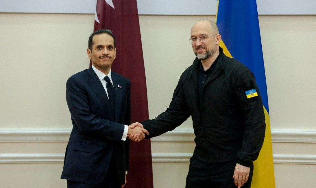 Ukrainian Prime Minister Denys Shmyhal and Qatari Prime Minister and Foreign Minister Sheikh Mohammed bin Abdulrahman bin Jassim Al Thani shake hands before a meeting, amid Russia's attack on Ukraine, in Kyiv, Ukraine July 28, 2023. 