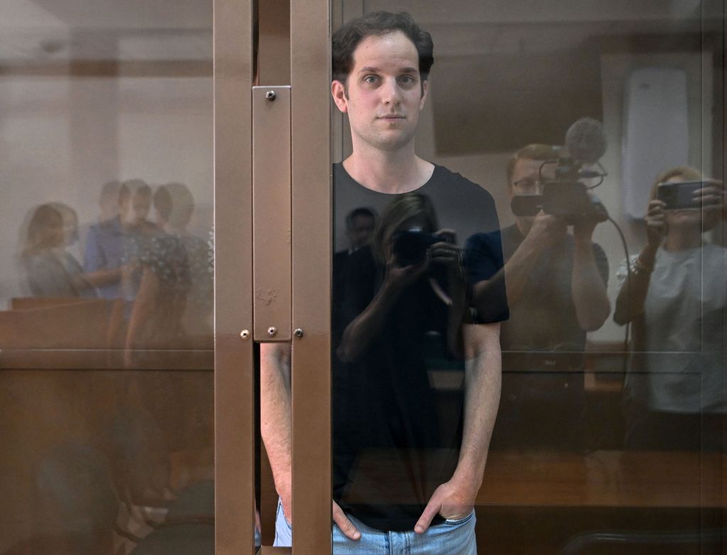 Gershkovich stands inside a defendant's cage before a hearing to consider an appeal on his extended detention at The Moscow City Court on June 22, 2023.