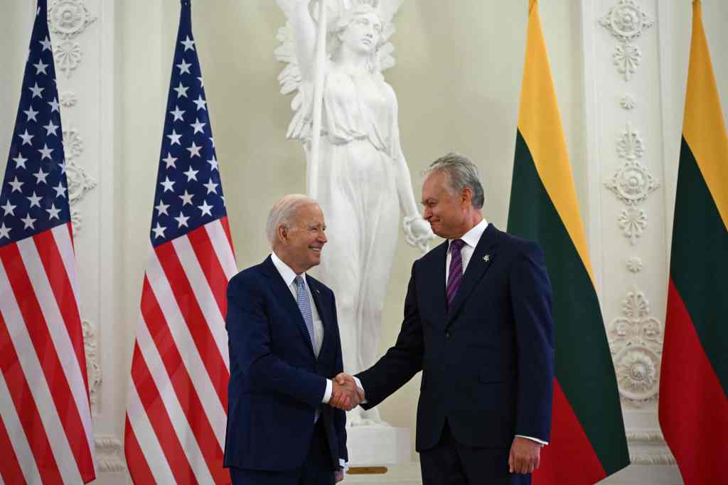 Lithuanian President Gitanas Nauseda and President Joe Biden shake hands during a bilateral meeting on the sidelines of a NATO Summit in Vilnius, Lithuania, on July 11, 2023. 