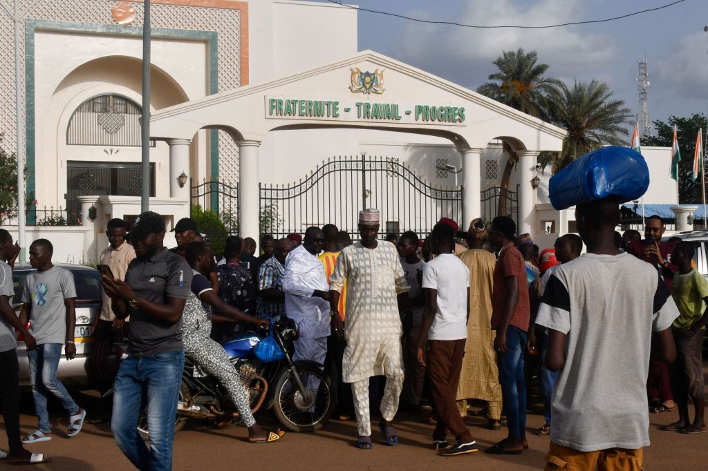 Demonstrators gather outside protesting President Mohamed Bazoum's detention by Presidential Guard in Niamey.