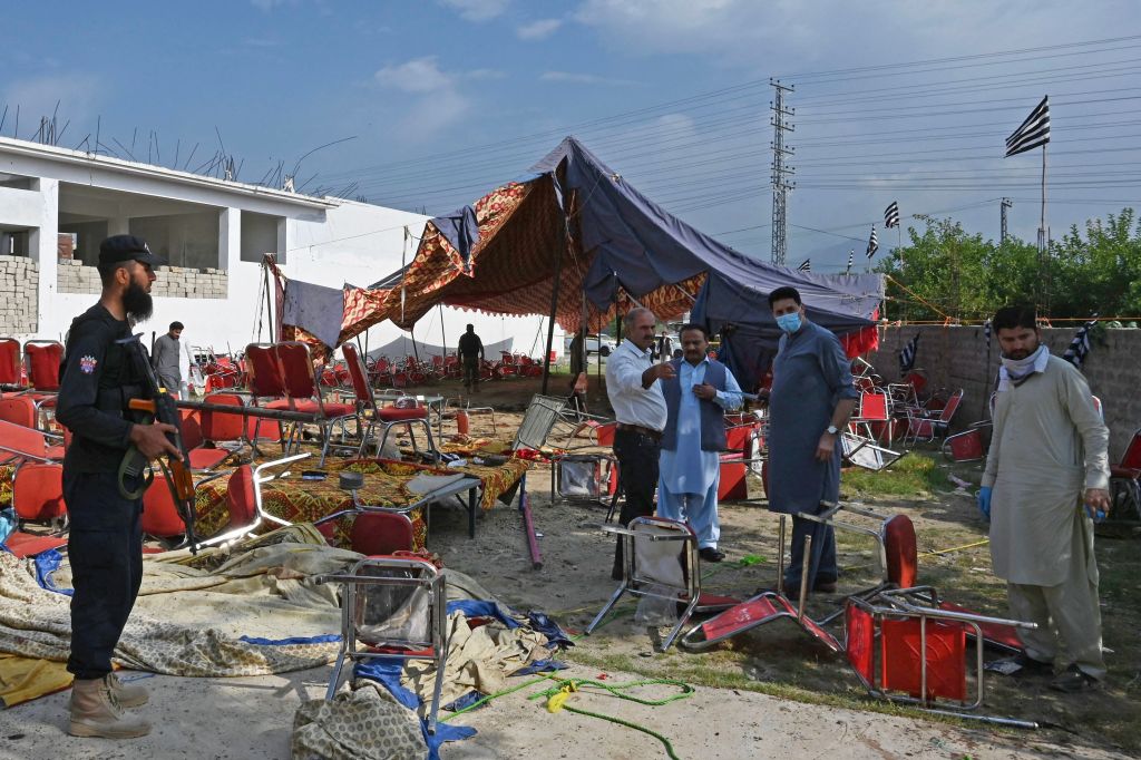 Security personnel examine the site of a bomb blast in Bajaur district of Khyber-Pakhtunkhwa province on July 31, 2023. 